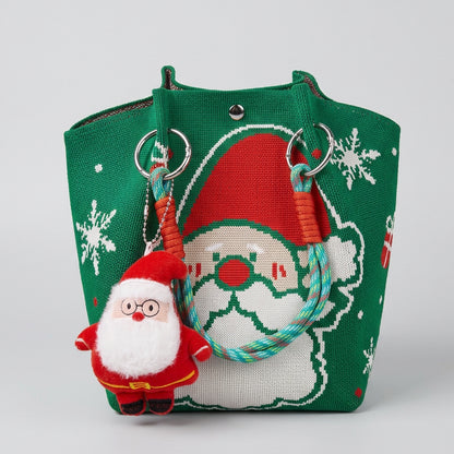 Green Christmas tote bag featuring a large Santa Claus pattern and a small plush Santa keychain.