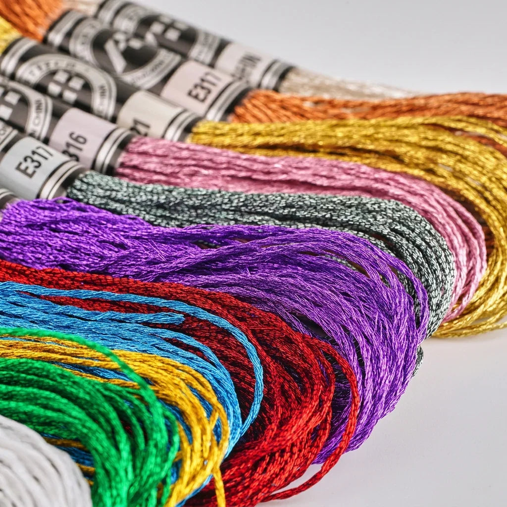 Assorted colorful metallic embroidery floss skeins by Calivra Craft in various shimmering shades.