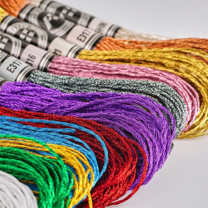 Assorted colorful metallic embroidery floss skeins by Calivra Craft in various shimmering shades.