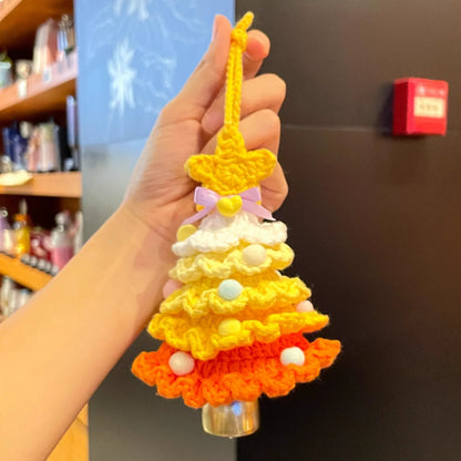 Handmade Calivra Craft knitted Christmas tree ornament in yellow and orange with a purple bow