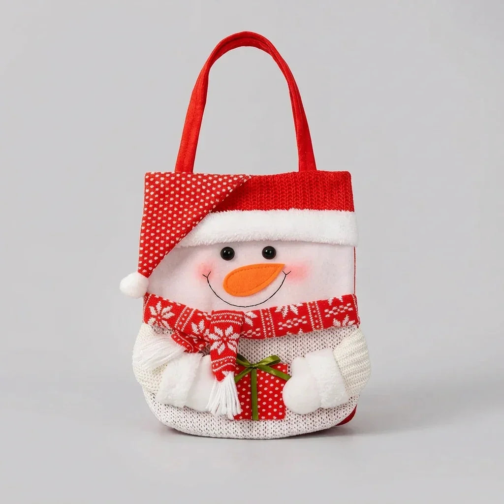 Knitted snowman Christmas gift bag with red polka dot hat and festive scarf.