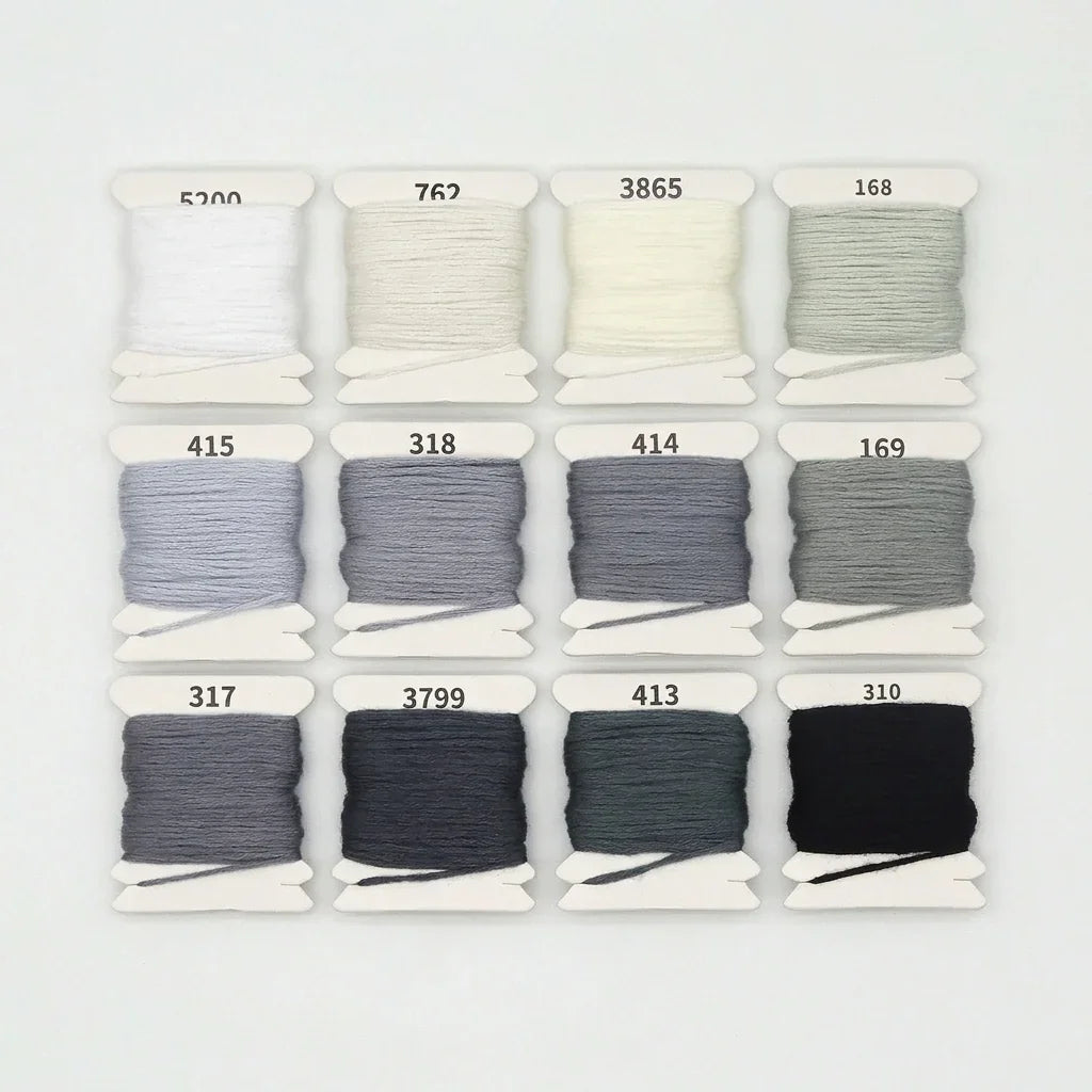 12 shades of gradient grey and white 6-strand cotton embroidery floss skeins.