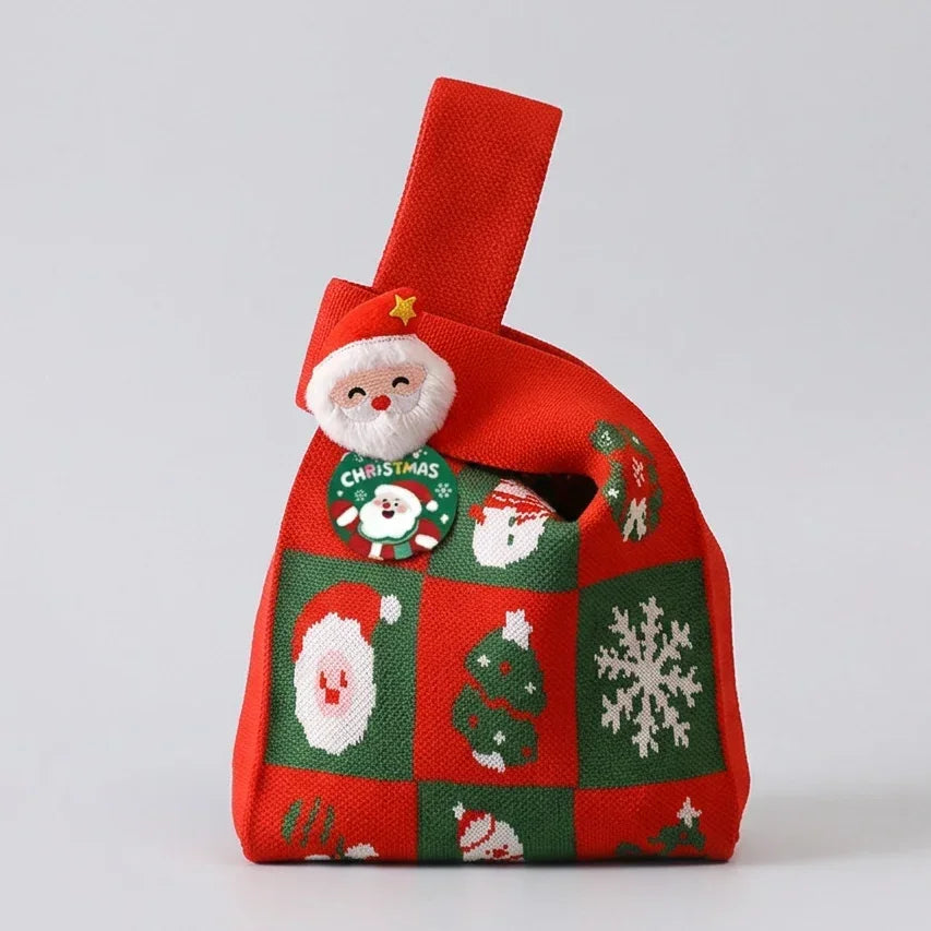 Red and green Christmas knitted gift bag with Santa Claus and snowflake patterns.