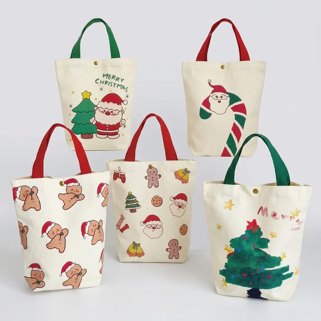 Set of five festive Christmas canvas gift bags with holiday prints like Santa and gingerbread.