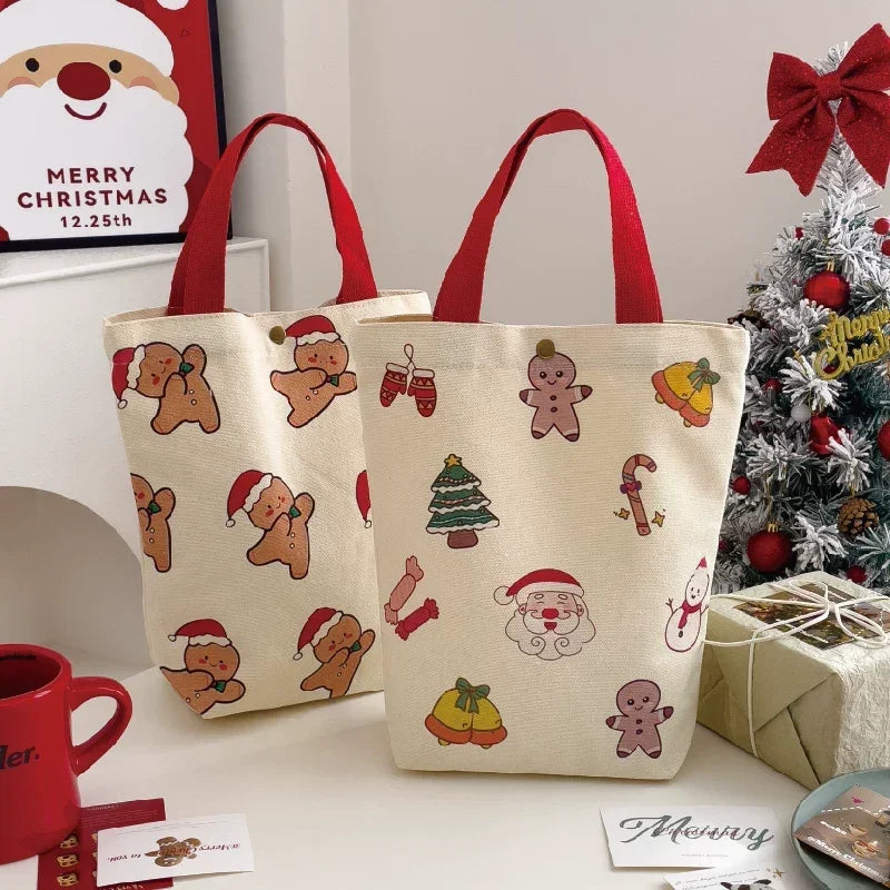 Two Christmas canvas gift bag storage totes with gingerbread man and Santa patterns.