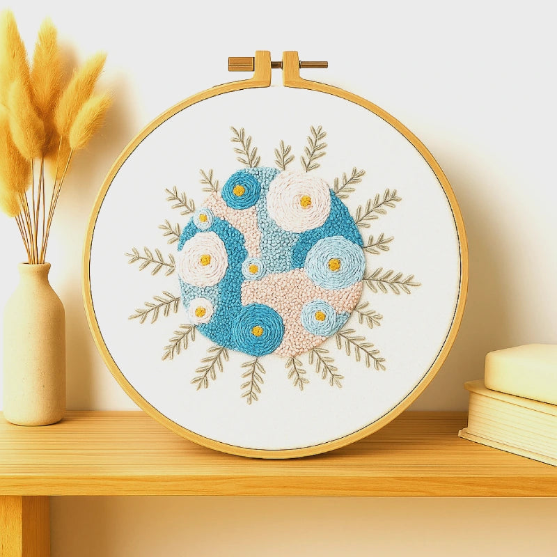 Inspired by the calm beauty of the sea, Ocean Bloom blends shades of blue, cream, and blush to create a soft floral rhythm that feels both refreshing and serene. Each stitched petal seems to sway like gentle waves, bringing a peaceful coastal touch to your home.