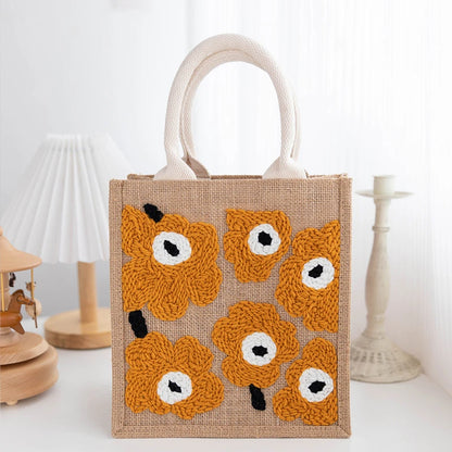Jute bag with crochet fox faces on a white background