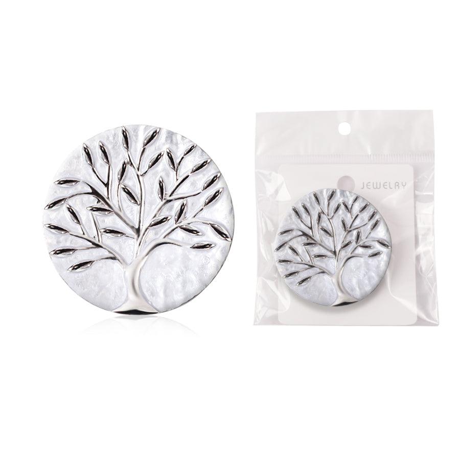 Silver tree-shaped earrings with packaging on a white background
