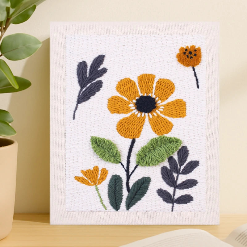 This design features bright golden-yellow flowers with deep navy centers and leaves, arranged on a clean white background for a simple yet elegant contrast.