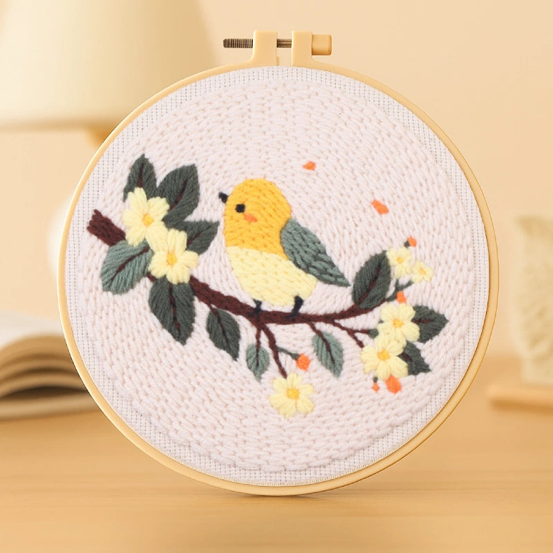 A yellow bird perches on a blooming branch, basking in gentle sunlight.
