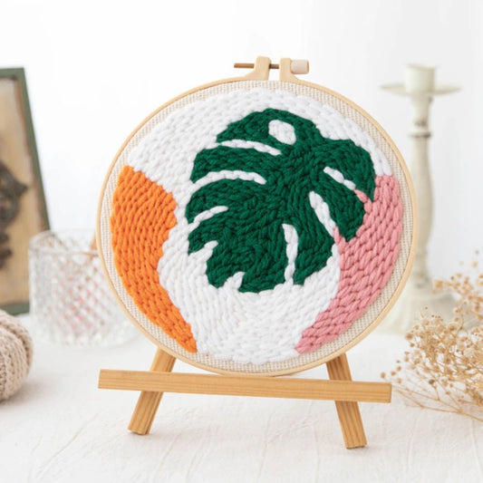 Punch Needle hoop with a leaf design on a white background