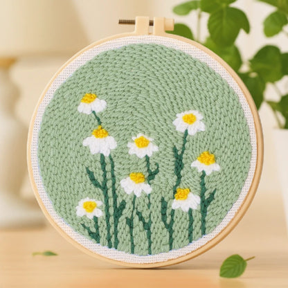 Set against a soft green background, clusters of white daisies bloom with golden centers that gleam like sunlight. The simple yet soothing design captures the quiet beauty of nature — calm, fresh, and full of life.
