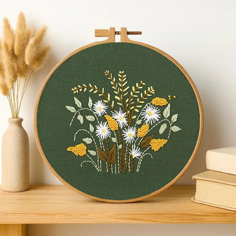 Embroidery hoop with floral design on a wooden shelf
