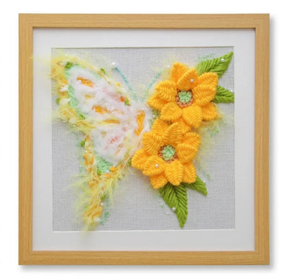 Floral butterfly punch needle kit art by Calivra Craft in a wooden frame.
