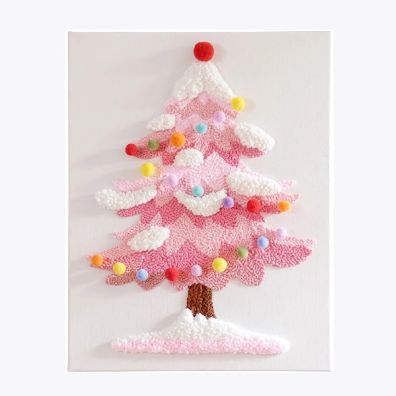 Pink punch needle embroidery of a Christmas tree with colorful ornaments and snow.