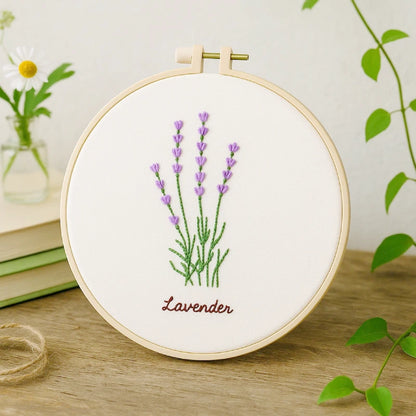 Embroidery hoop with lavender design on a wooden surface