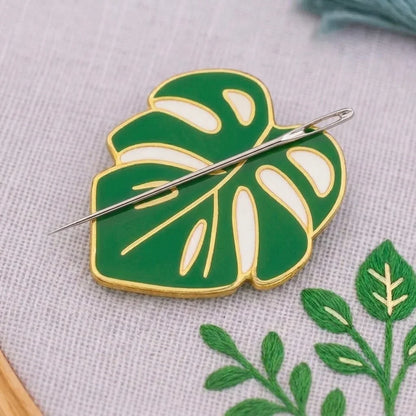Calivra Craft Monstera magnetic needle minder in green and white enamel.