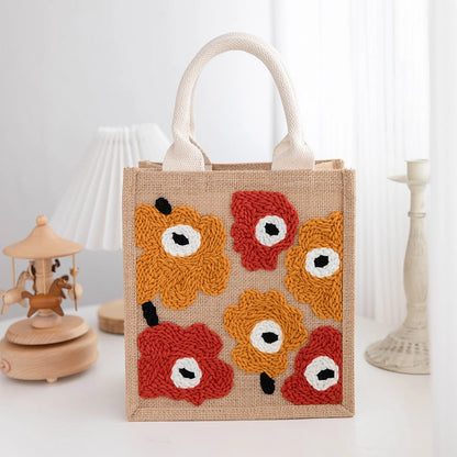 Jute bag with floral patterns on a white background